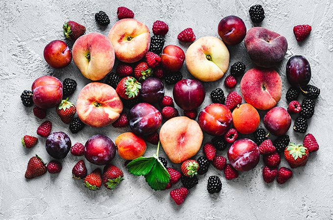 Various types of fruits on white background